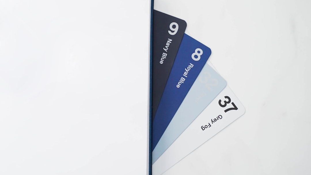 a-close-up-of-a-white-wall-with-a-blue-tag-chhhuopzitc